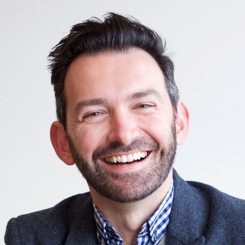 Portrait of smiling businessman sitting in office