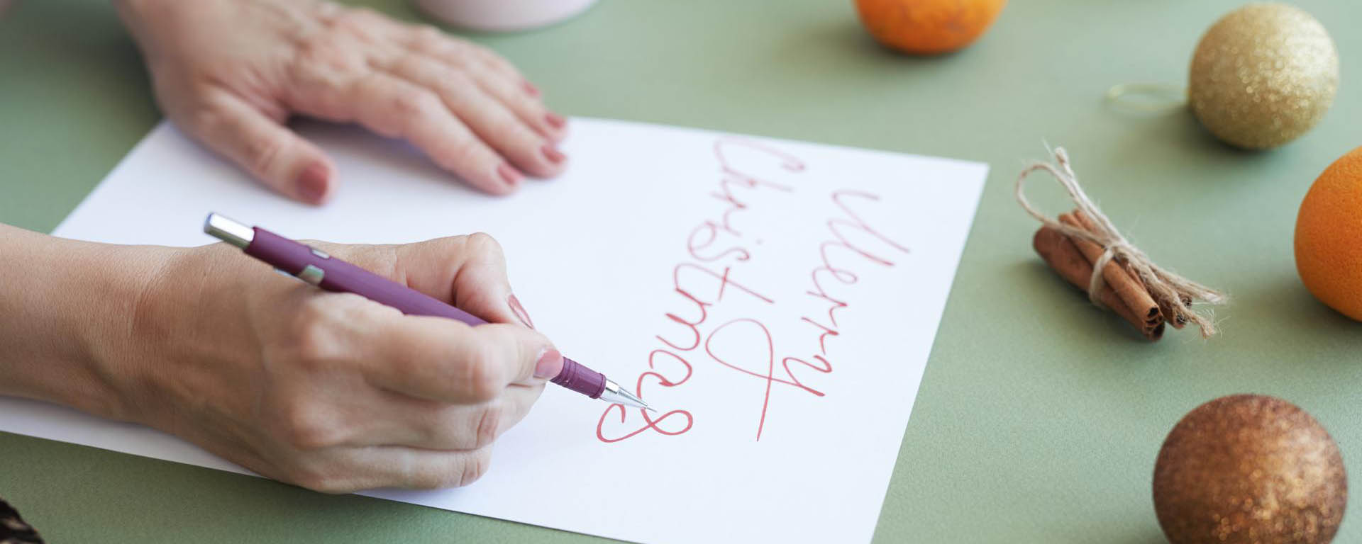 making-lettering-for-christmas-card-F5WTHZK-compressed-width