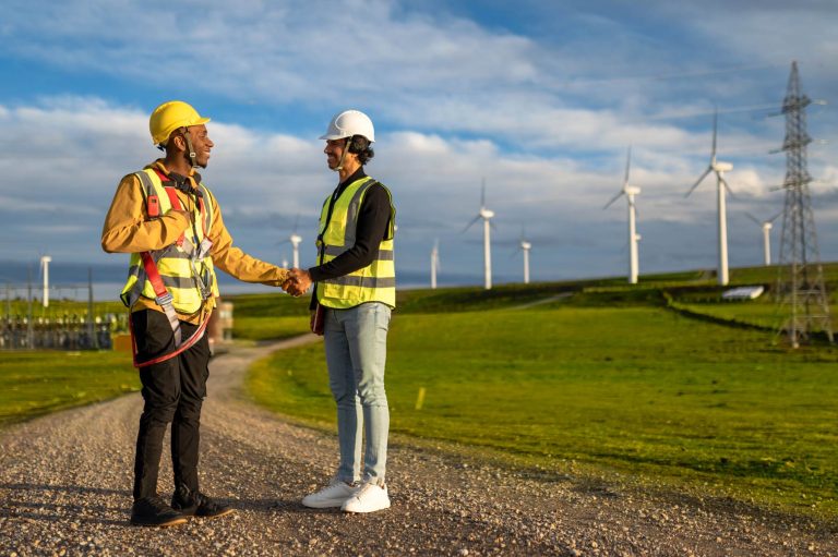 wind-turbine-engineers-shaking-hands-in-a-wind-far-2025-05-14-23-40-17-utc