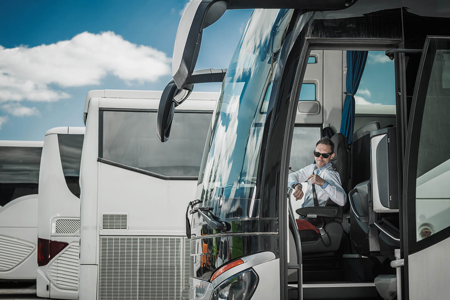 bus-driver-pointing-at-wrist-watch-2022-12-16-11-43-18-utc